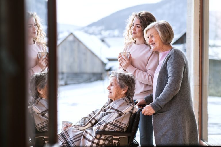 A teenage girl with mother and grandmother at home