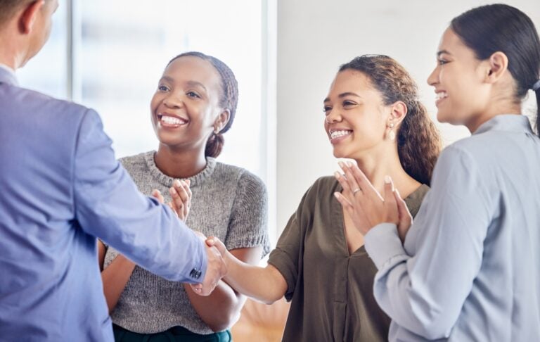 happy caregivers, employees, congratulating each other - showing concepts of rewards, recognitions