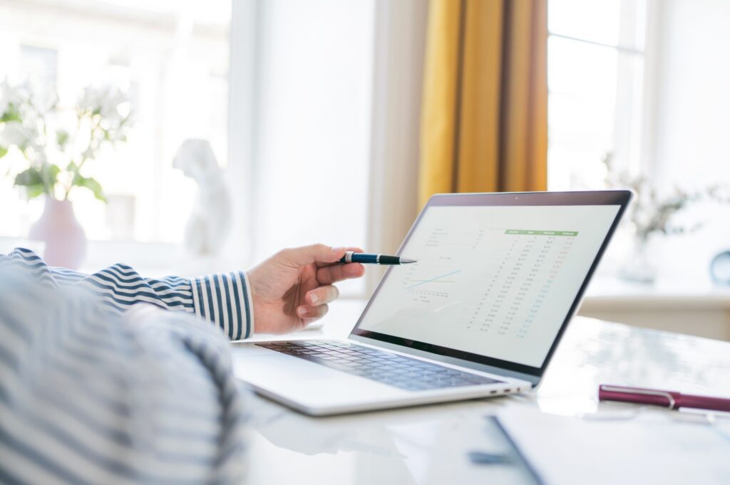 employee checking invoices online, concept of ebilling and online invoicing