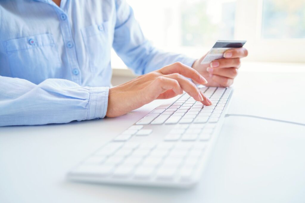 Woman using a credit card for online payments