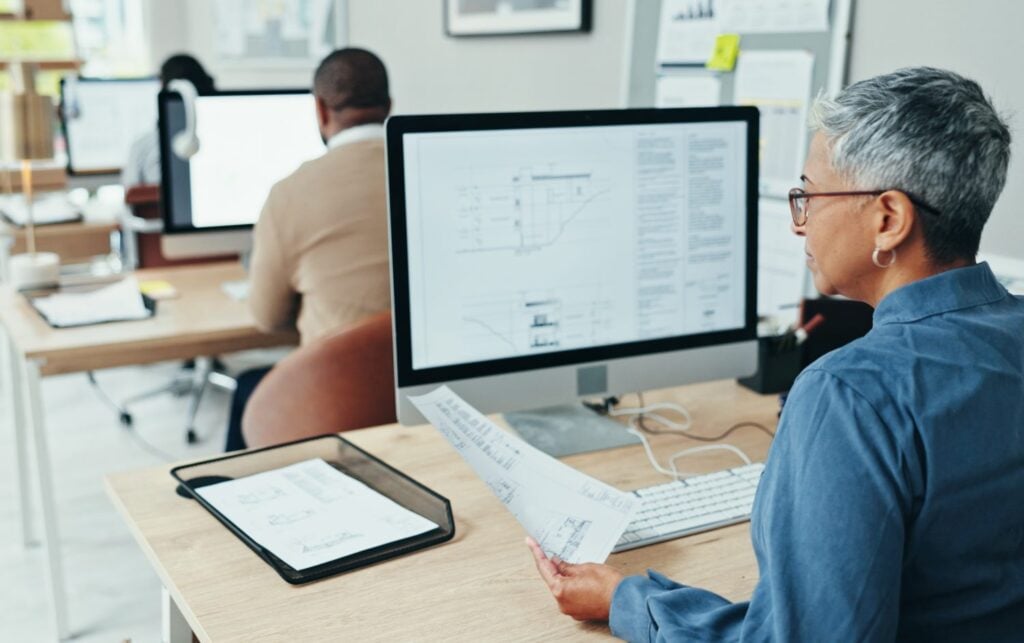 group of employees working in an office setting, concept of customer support team