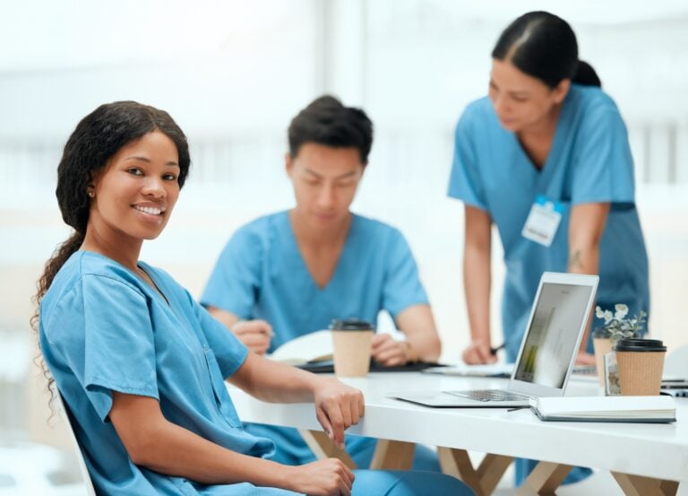 team of caregivers in a home care, using computer, homecare software concept