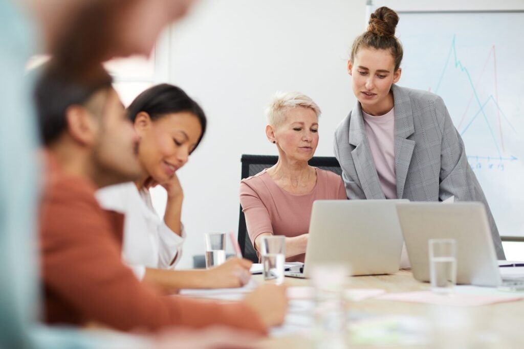 team of women having a meeting or training session, concept of childcare training