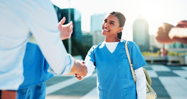 female caregiver doing a handshake for support, agreement