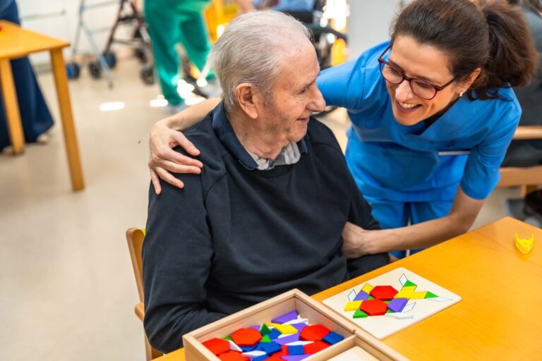 senior man having mental exercises and puzzles, concept of home care and managing dementia
