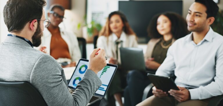 businessman in meeting with team for planning, financial analysis or performance