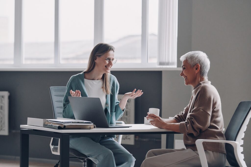 senior woman having a meeting with a home care representative in the office