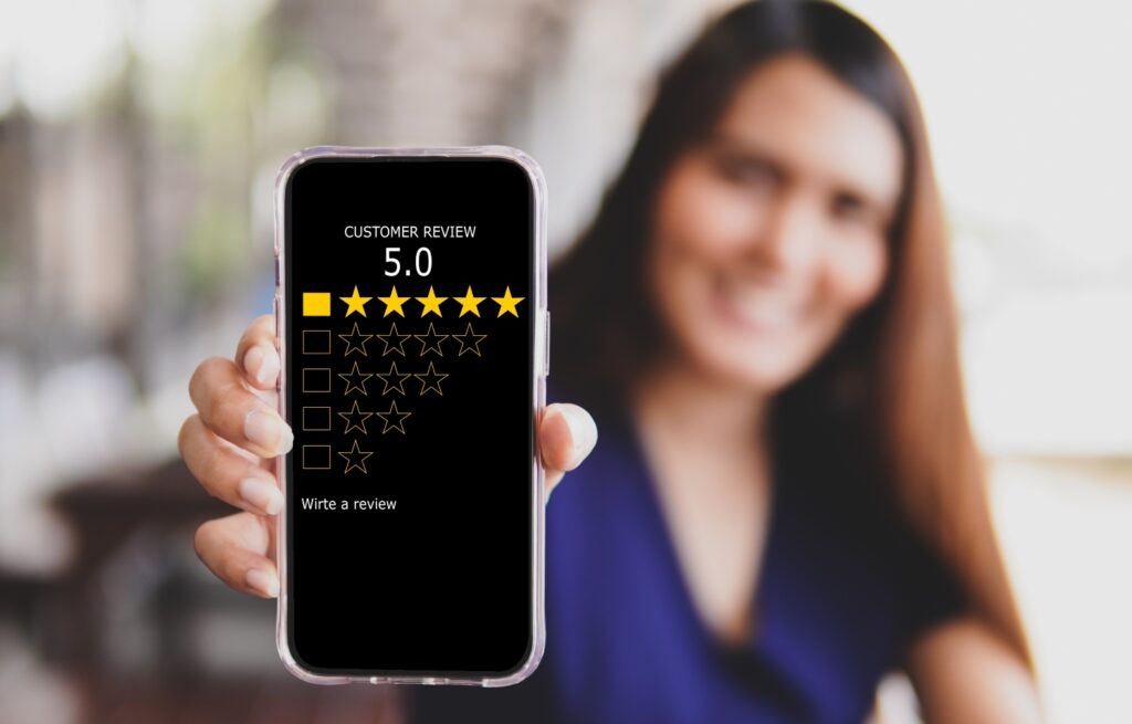 women holding the smartphone with visual screen of a satisfaction rating and review