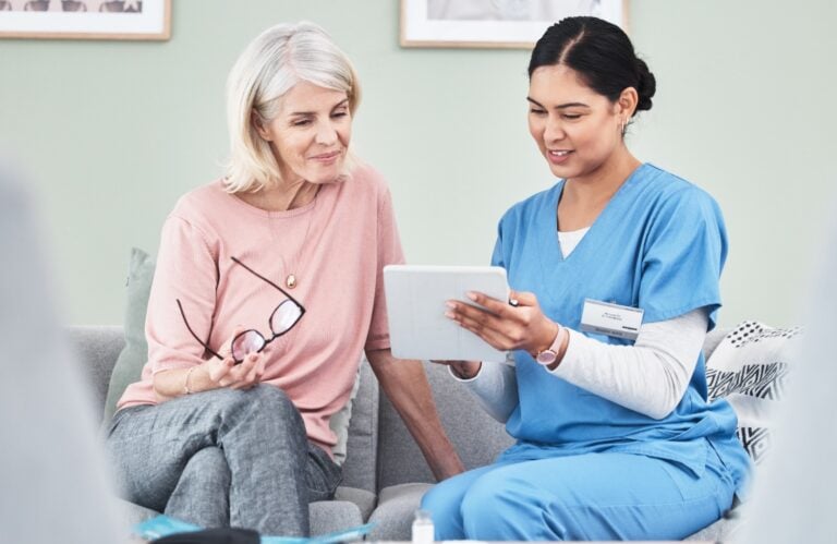 Friendly Healthcare Professional Visits with Senior Woman