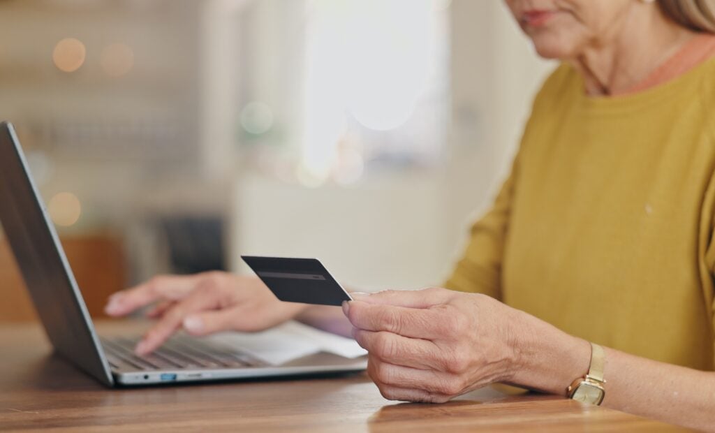 elderly woman processing payment online