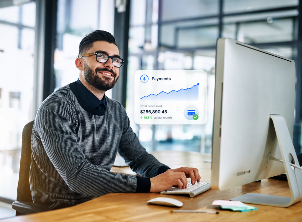 male employee assessing payment processing dashboard