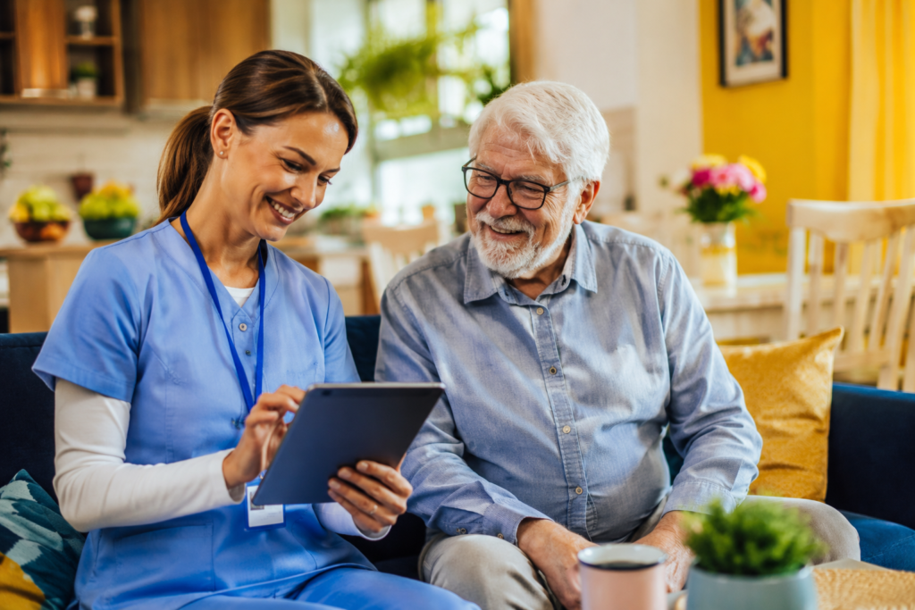 caregiver checking in using EVV on her tablet device during a home visit.