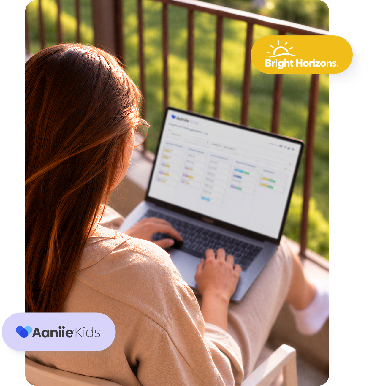 Woman using a laptop to review childcare agency information outdoors