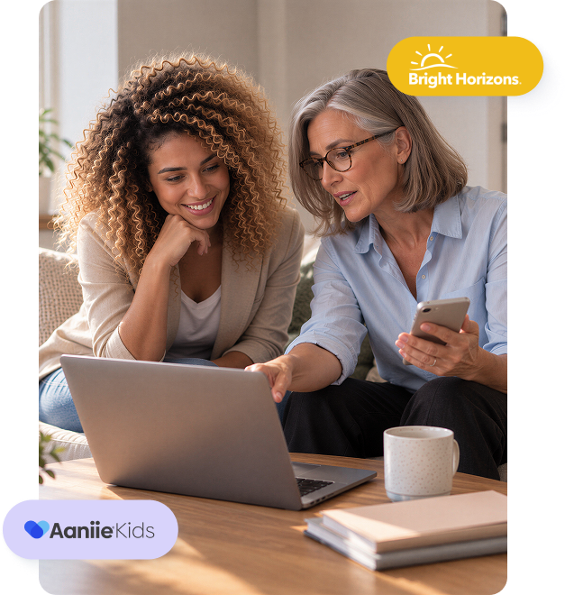 Two childcare agency professionals reviewing business information on a laptop